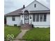 Charming single-story home featuring a well-maintained lawn and inviting front porch at 341 Barton Ave, Indianapolis, IN 46241