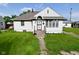 Charming single-story home featuring a well-maintained lawn and inviting front porch at 341 Barton Ave, Indianapolis, IN 46241