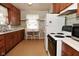 Quaint kitchen with wooden cabinets, classic appliances, and vintage charm at 341 Barton Ave, Indianapolis, IN 46241