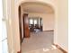 Inviting living room with hardwood floors and an arched entryway to the dining room at 341 Barton Ave, Indianapolis, IN 46241