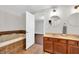 Inviting bathroom with dual vanity, soaking tub, and modern fixtures at 350 N Meridian St # 705, Indianapolis, IN 46204