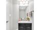 Stylish powder room with black vanity, modern fixtures, and decorative accents at 350 N Meridian St # 705, Indianapolis, IN 46204