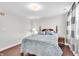 Cozy bedroom with wood flooring, a queen-size bed and natural light at 350 N Meridian St # 705, Indianapolis, IN 46204