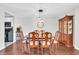 Traditional dining room with wood floors, a ceiling light and an antique cabinet at 350 N Meridian St # 705, Indianapolis, IN 46204