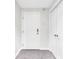 Hallway showcasing a white door, tile floors, and closet with chrome hardware at 350 N Meridian St # 705, Indianapolis, IN 46204