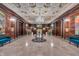 Luxurious lobby featuring decorative ceilings, marble floors, crystal chandelier, and seating at 350 N Meridian St # 705, Indianapolis, IN 46204