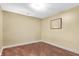 Room with light tan walls and dark wood flooring, bright overhead lighting at 350 N Meridian St # 705, Indianapolis, IN 46204