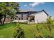 Expansive backyard with lush green lawn and a view of the home's rear elevation at 3713 Cherwell Dr, Zionsville, IN 46077