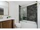 Modern bathroom with dark brick tile, a glass shower door, and a wood vanity at 3713 Cherwell Dr, Zionsville, IN 46077