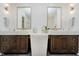 Elegant bathroom with double vanity, marble countertops, and dark wood cabinets at 3713 Cherwell Dr, Zionsville, IN 46077