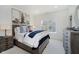 Charming bedroom with neutral tones features a comfortable bed, stylish decor, and ample natural light at 3713 Cherwell Dr, Zionsville, IN 46077