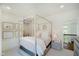 Bright and airy bedroom features a four-poster bed, soft decor, and tranquil ambiance at 3713 Cherwell Dr, Zionsville, IN 46077