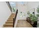 Bright foyer with hardwood floors, staircase, and double doors at 3713 Cherwell Dr, Zionsville, IN 46077