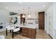 Gourmet kitchen featuring a large island with seating, hardwood floors, and pendant lighting at 3713 Cherwell Dr, Zionsville, IN 46077