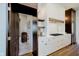 A gourmet kitchen features white counters, wood accents, and view of the hall with a butler's pantry at 3713 Cherwell Dr, Zionsville, IN 46077