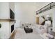 Bright living room with fireplace, hardwood floors and staircase in background at 3713 Cherwell Dr, Zionsville, IN 46077