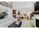 Open-concept living room featuring hardwood floors and seamless flow to kitchen at 3713 Cherwell Dr, Zionsville, IN 46077
