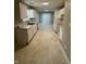 Clean kitchen featuring white cabinets, marble countertops, and stainless steel sink at 3861 Candle Berry Dr, Indianapolis, IN 46235