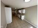 Inviting kitchen with tile flooring, modern countertops, and updated cabinets with modern appliances at 3861 Candle Berry Dr, Indianapolis, IN 46235