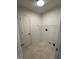 Functional laundry area with sleek door and convenient wire shelving at 3861 Candle Berry Dr, Indianapolis, IN 46235