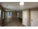 Bright, open-concept living room featuring wood floors and neutral paint throughout at 3861 Candle Berry Dr, Indianapolis, IN 46235