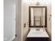 Half bathroom featuring a vanity with a sink, mirror, and decorative fixtures at 3975 Offshore Dr, Columbus, IN 47203