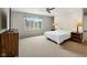 Spacious bedroom with carpet, large window, neutral colors, and standard closet at 3975 Offshore Dr, Columbus, IN 47203