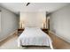 Comfortable bedroom featuring carpet, overhead lighting, and nightstands with reading lamps at 3975 Offshore Dr, Columbus, IN 47203