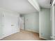 Minimalist bedroom showcasing neutral paint, carpet, and closet for a streamlined look at 3975 Offshore Dr, Columbus, IN 47203