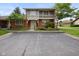Inviting brick home with balcony and well-kept greenery, offering comfortable living at 3975 Offshore Dr, Columbus, IN 47203