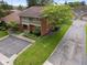 Charming brick home with balcony, lush lawn, and convenient parking area at 3975 Offshore Dr, Columbus, IN 47203