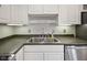 Close-up of a stainless steel sink with modern faucet set against the countertop at 3975 Offshore Dr, Columbus, IN 47203