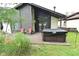 Backyard deck with a hot tub, seating, and open views, perfect for relaxation at 4029 Gamay Ln, Indianapolis, IN 46254
