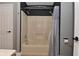 Bathroom features a shower with a shower curtain and gray walls at 4029 Gamay Ln, Indianapolis, IN 46254