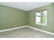 Bedroom with wood floors and view of back yard at 4029 Gamay Ln, Indianapolis, IN 46254