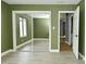 Bedroom with sliding mirror closet doors, window, and open doorway at 4029 Gamay Ln, Indianapolis, IN 46254