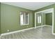 Bedroom features a sliding glass door closet, window, and neutral wall color at 4029 Gamay Ln, Indianapolis, IN 46254