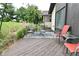 Outdoor patio with a dining table, seating, and a view of the landscaped yard at 4029 Gamay Ln, Indianapolis, IN 46254