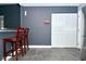 View of kitchen area featuring tiled floors and a gray accent wall at 4029 Gamay Ln, Indianapolis, IN 46254