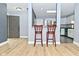 Open concept kitchen area with a breakfast bar that adjoins the living space at 4029 Gamay Ln, Indianapolis, IN 46254