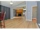 Inviting living room featuring a stone fireplace, hardwood flooring, and a neutral color scheme at 4029 Gamay Ln, Indianapolis, IN 46254