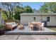 Comfortable deck in backyard featuring wood furniture, perfect for outdoor entertaining and relaxation at 420 Vista Dr, Carmel, IN 46280