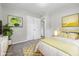 Well-lit bedroom boasts soft rug, plant, and modern decor for a comfortable and inviting space at 420 Vista Dr, Carmel, IN 46280