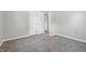 This gray painted bedroom features carpeted floors and a view to an adjacent room at 420 Vista Dr, Carmel, IN 46280