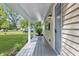 View of the covered porch featuring a painted deck, side house view, and a lovely exterior view at 420 Vista Dr, Carmel, IN 46280