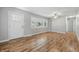 Inviting living room with hardwood floors, freshly painted walls, and a large window offering plenty of natural light at 420 Vista Dr, Carmel, IN 46280