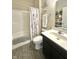 Clean bathroom featuring a shower and tub combo with modern fixtures at 4209 Switchgrass Way, Indianapolis, IN 46237