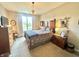 Bright bedroom with a large window and a decorative ceiling light fixture at 4209 Switchgrass Way, Indianapolis, IN 46237