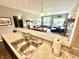 Open kitchen with stainless steel sink and view of the living room at 4209 Switchgrass Way, Indianapolis, IN 46237