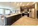 Modern kitchen featuring stainless steel appliances, granite countertops, and dark cabinetry at 4209 Switchgrass Way, Indianapolis, IN 46237